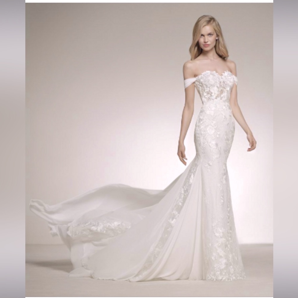 Pronovias Davinia with slight alterations. Label 10 , street size 8.